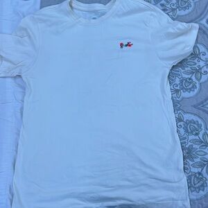 Nike tee shirt , color- yellow , Size Small, Nike sign with roses around it
